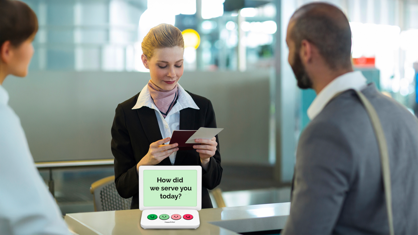 Customer at public service counter smiley feedback table survey